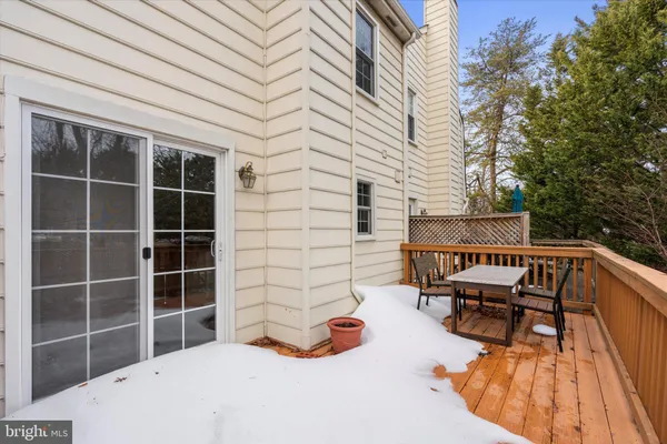 a balcony with furniture and a potted plant