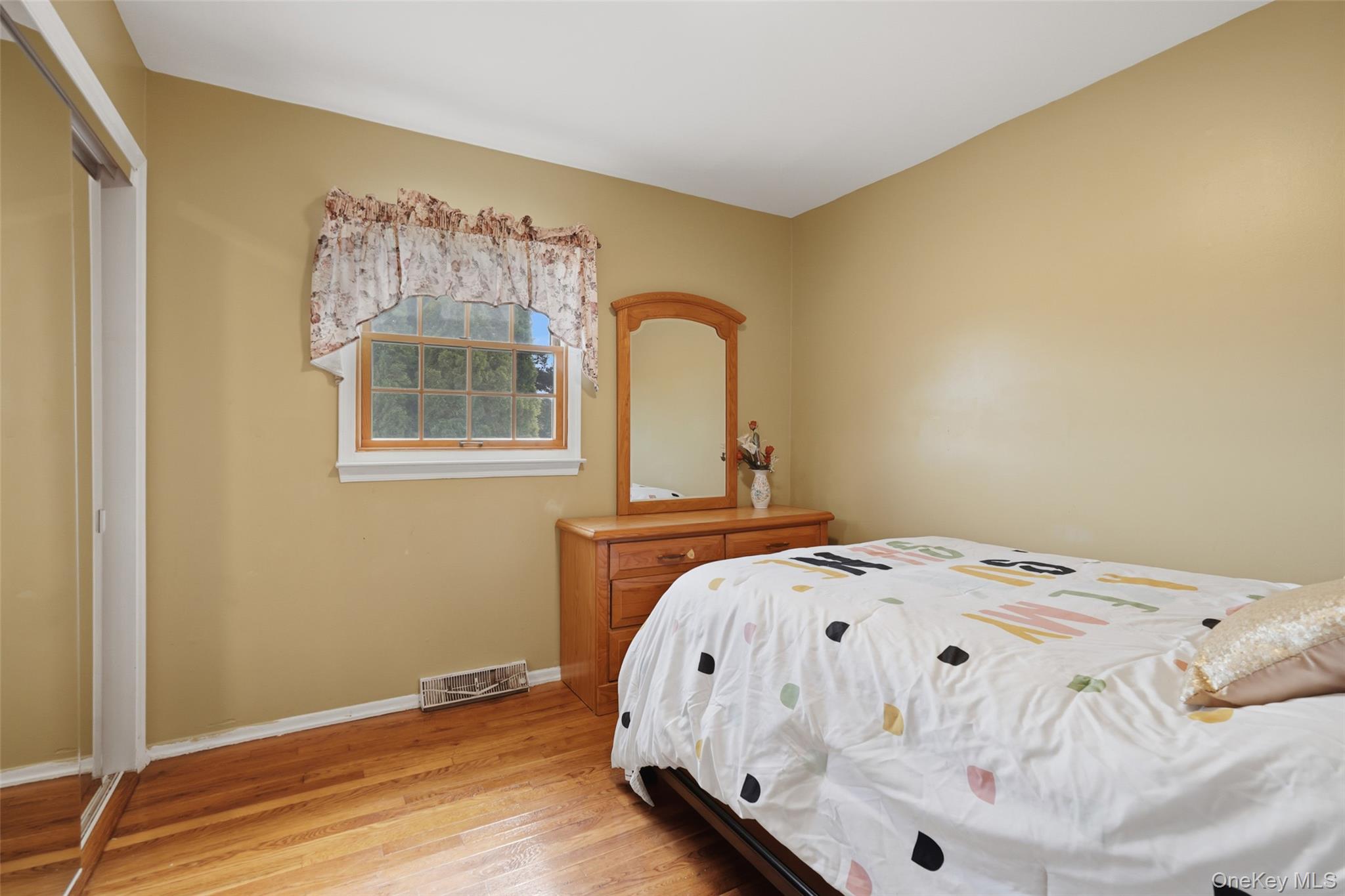 623 Cardinal Road Cortlandt Manor, NY 10567 - Photo 16 of 40 a bed sitting in a bedroom next to a window