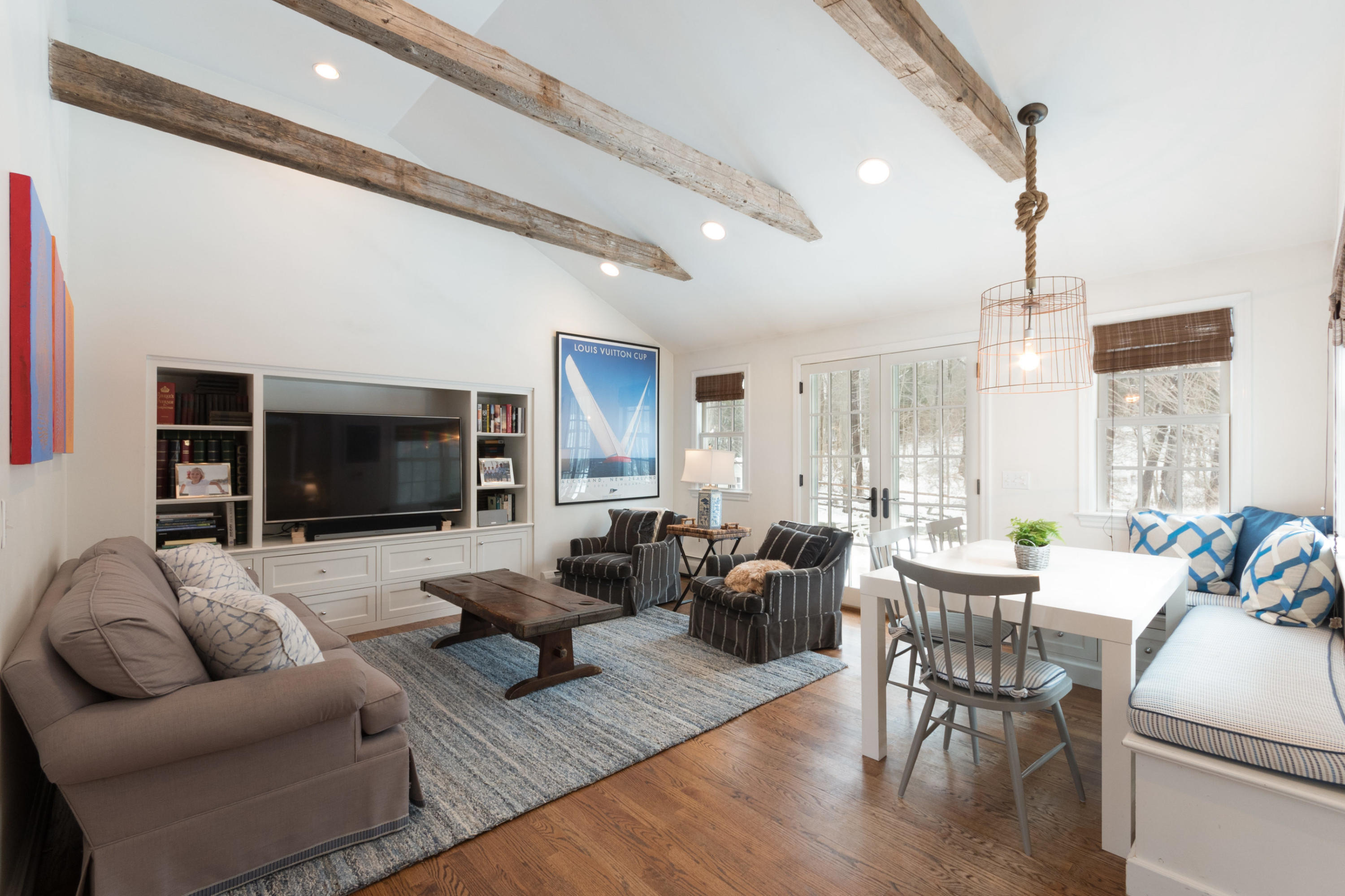 183 Smith Ridge Road New Canaan, CT 06840 - Photo 12 of 30 a living room with furniture flat screen tv and large window