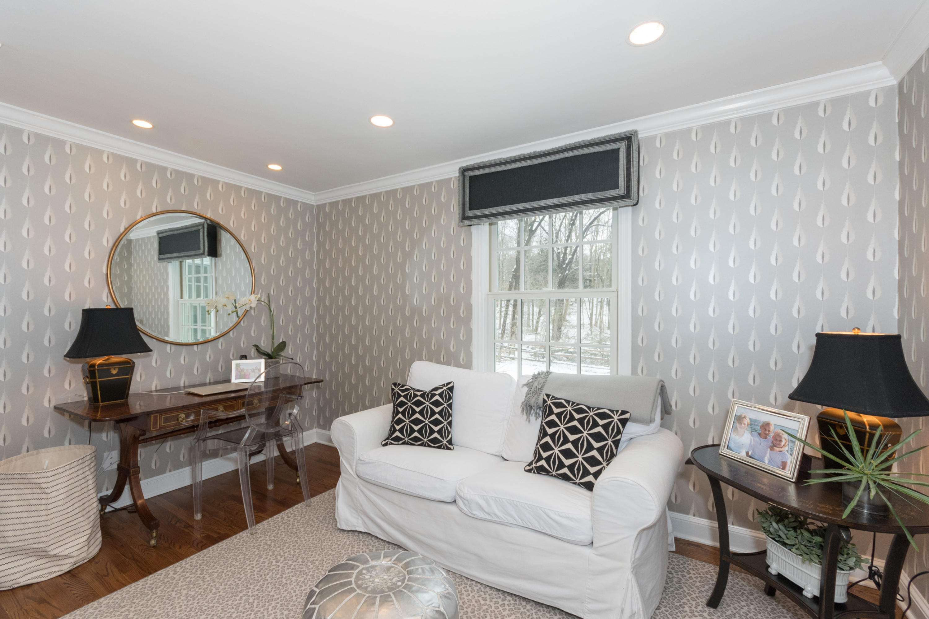 183 Smith Ridge Road New Canaan, CT 06840 - Photo 17 of 30 a living room with furniture a rug and a window