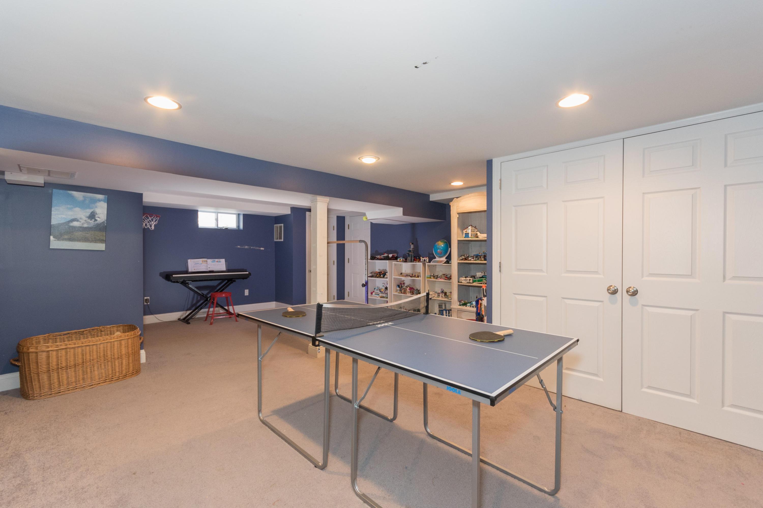 183 Smith Ridge Road New Canaan, CT 06840 - Photo 23 of 30 a living room with furniture a table and kitchen view