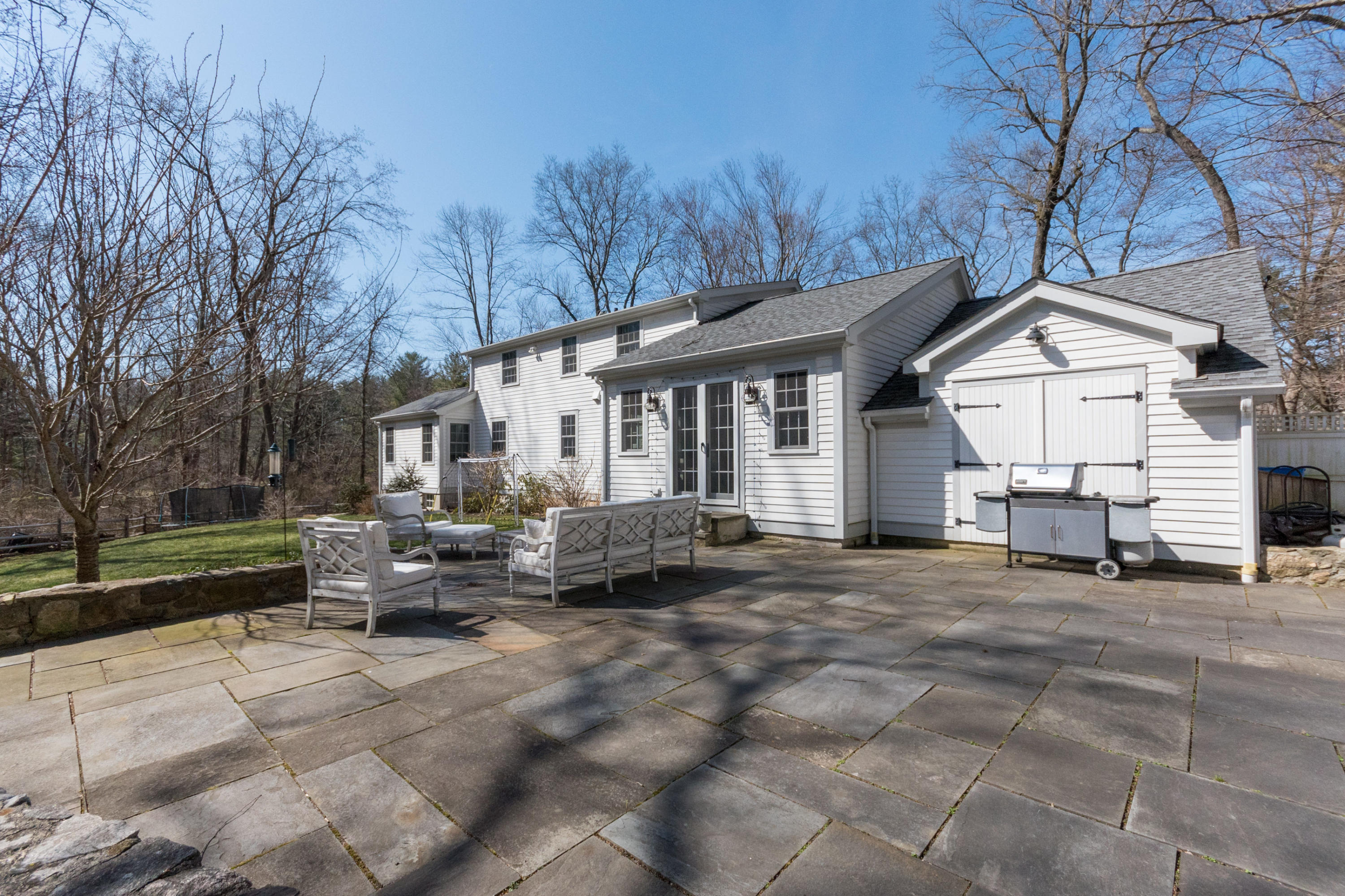 183 Smith Ridge Road New Canaan, CT 06840 - Photo 26 of 30 a view of a house with a patio