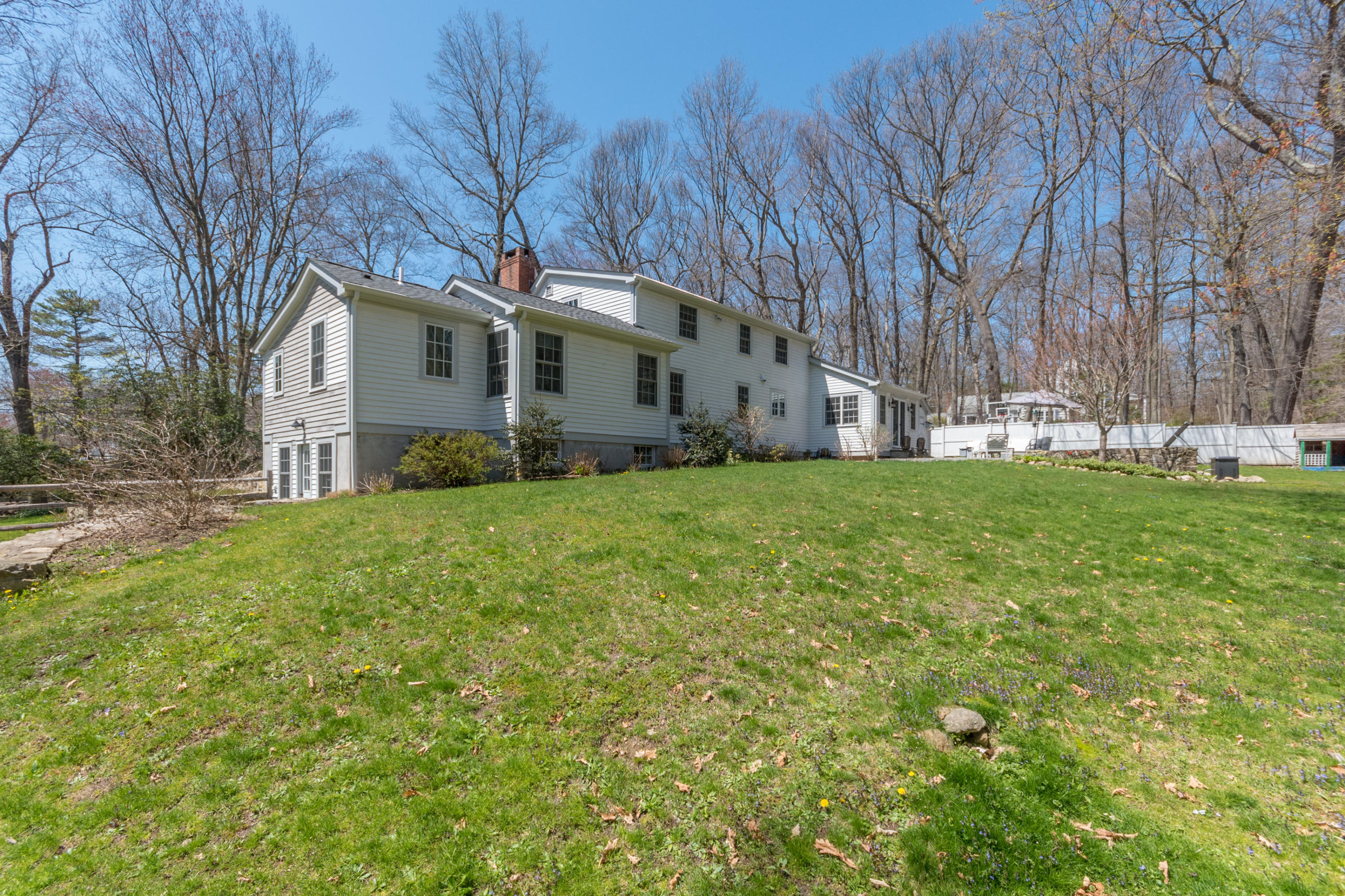 183 Smith Ridge Road New Canaan, CT 06840 - Photo 27 of 30 a view of a house with a yard