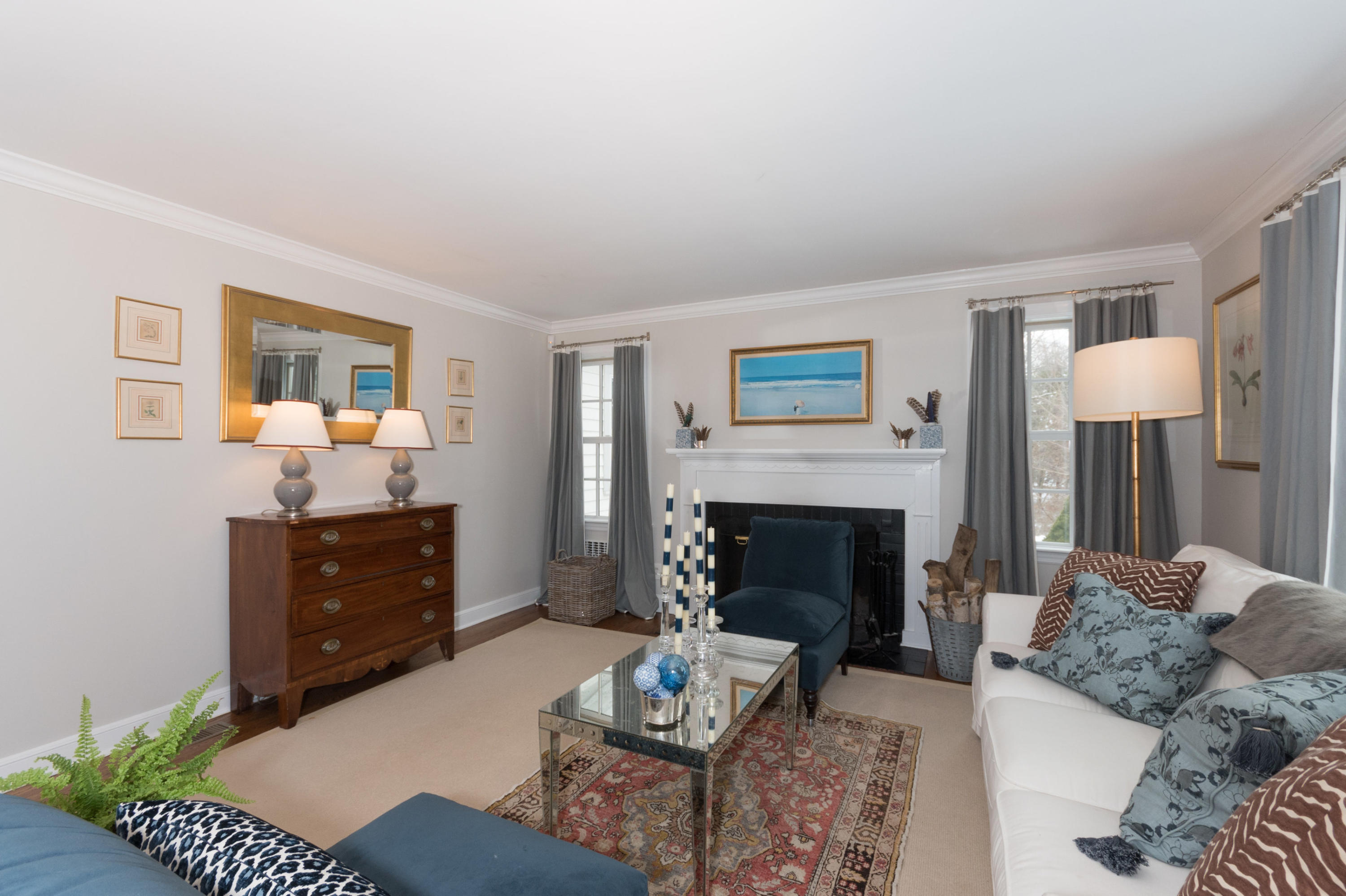 183 Smith Ridge Road New Canaan, CT 06840 - Photo 4 of 30 a living room with furniture and a fireplace
