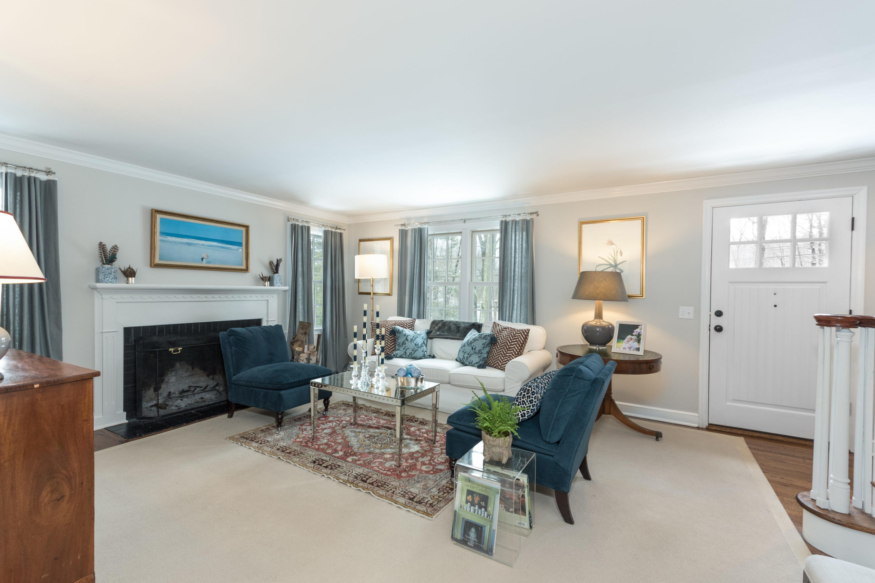 183 Smith Ridge Road New Canaan, CT 06840 - Photo 5 of 30 a living room with furniture and a fireplace