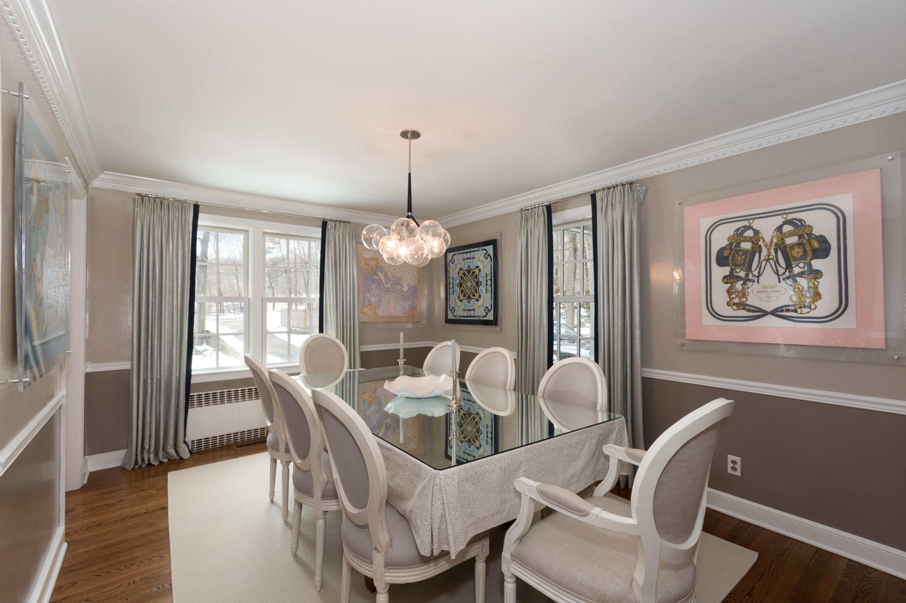 183 Smith Ridge Road New Canaan, CT 06840 - Photo 7 of 30 a dining room with furniture a chandelier and wooden floor