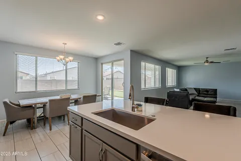 a dining room with a table chairs and wooden floor