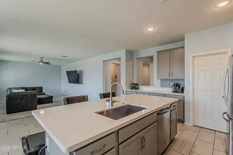 a view of a dining room with furniture wooden floor and chandelier