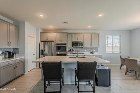 a room with lots of books and a large window