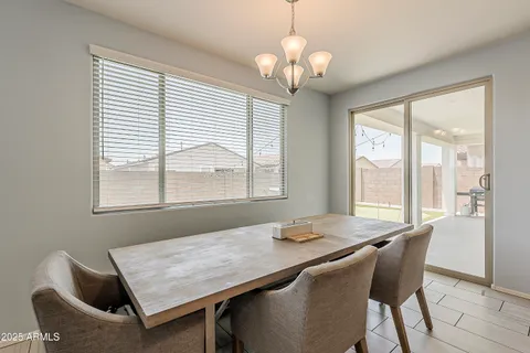 a bedroom with a bed couch and window
