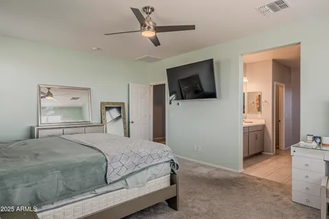 a bedroom with furniture and a bathtub