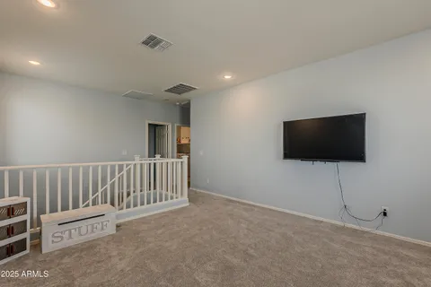 a view of a patio with table and chairs near a yard