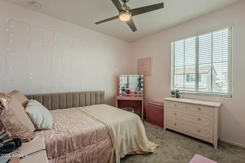 a front view of a house with yard and tree s