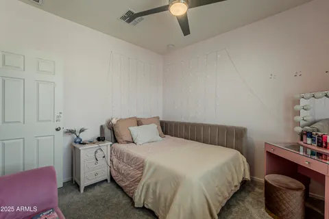 a view of a garden and swimming pool in a yard