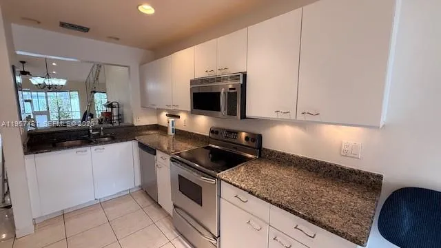a bathroom with a sink a mirror and a bath tub