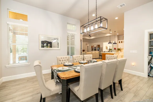 a living room with fireplace furniture and a wooden floor