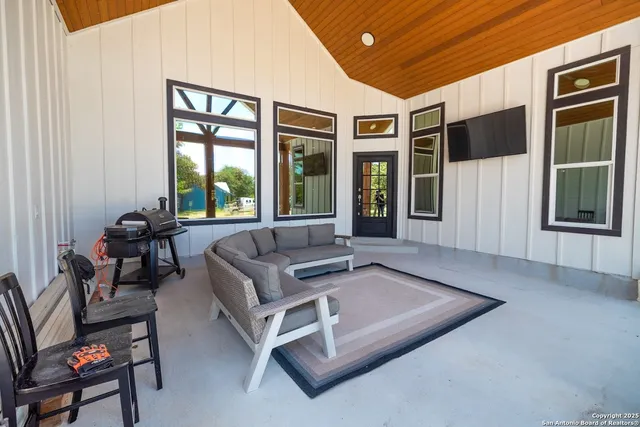 a living room with furniture and a window