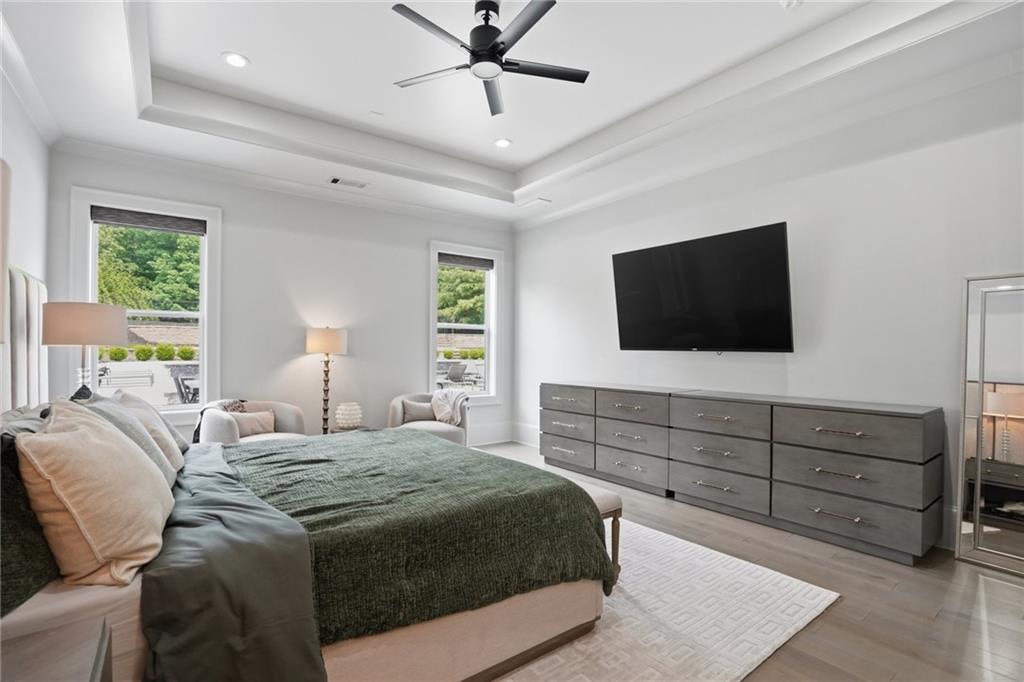 3020 Wallace Road Buford, GA 30519 - Photo 25 of 66 a bedroom with a bed a window and a flat screen television
