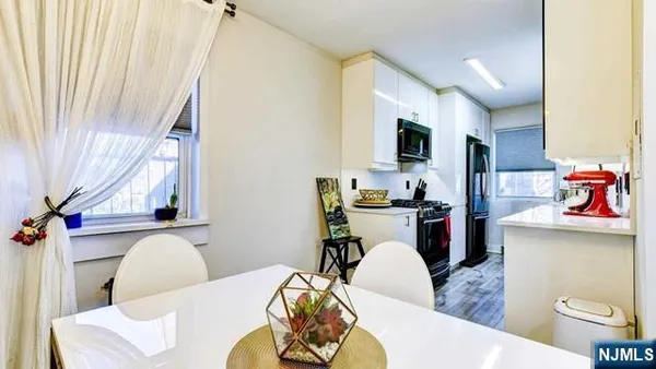 a kitchen with stainless steel appliances granite countertop a stove and a sink