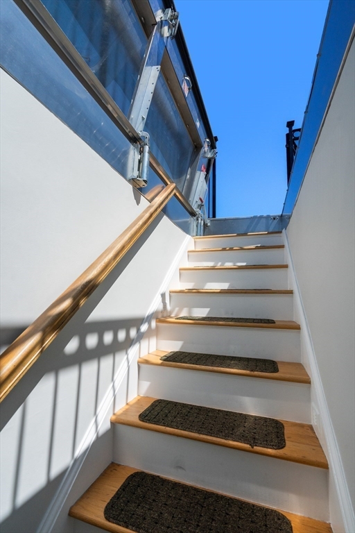 17 Worcester Street, Unit 9 Boston, MA 02118 - Photo 12 of 18 a view of staircase with white walls and a window