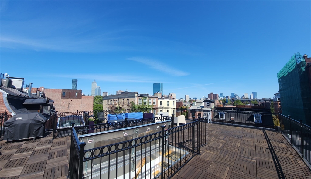 17 Worcester Street, Unit 9 Boston, MA 02118 - Photo 17 of 18 a view of a balcony with wooden benches