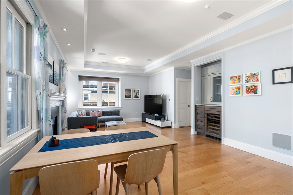17 Worcester Street, Unit 9 Boston, MA 02118 - Photo 2 of 18 a living room with furniture a flat screen tv and a large window