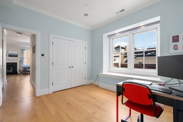 a workspace with furniture and window