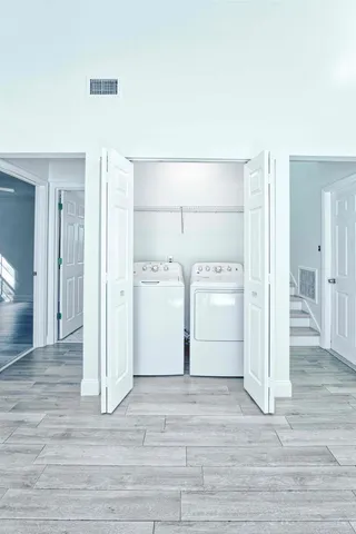 a bathroom with a granite countertop toilet a sink and a bathtub