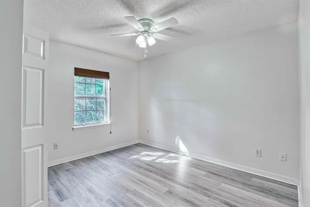 a view of hallway with wooden floor