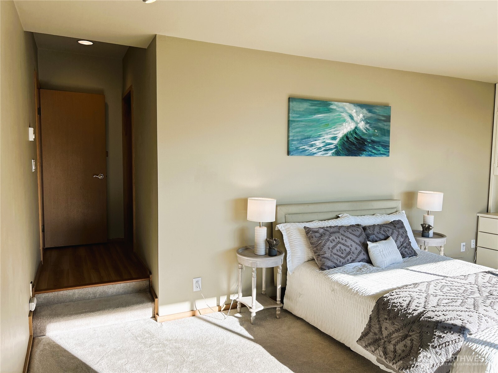 620 West Mercer Place, Unit 2B Seattle, WA 98119 - Photo 13 of 28 a bedroom with a bed and a painting on the wall