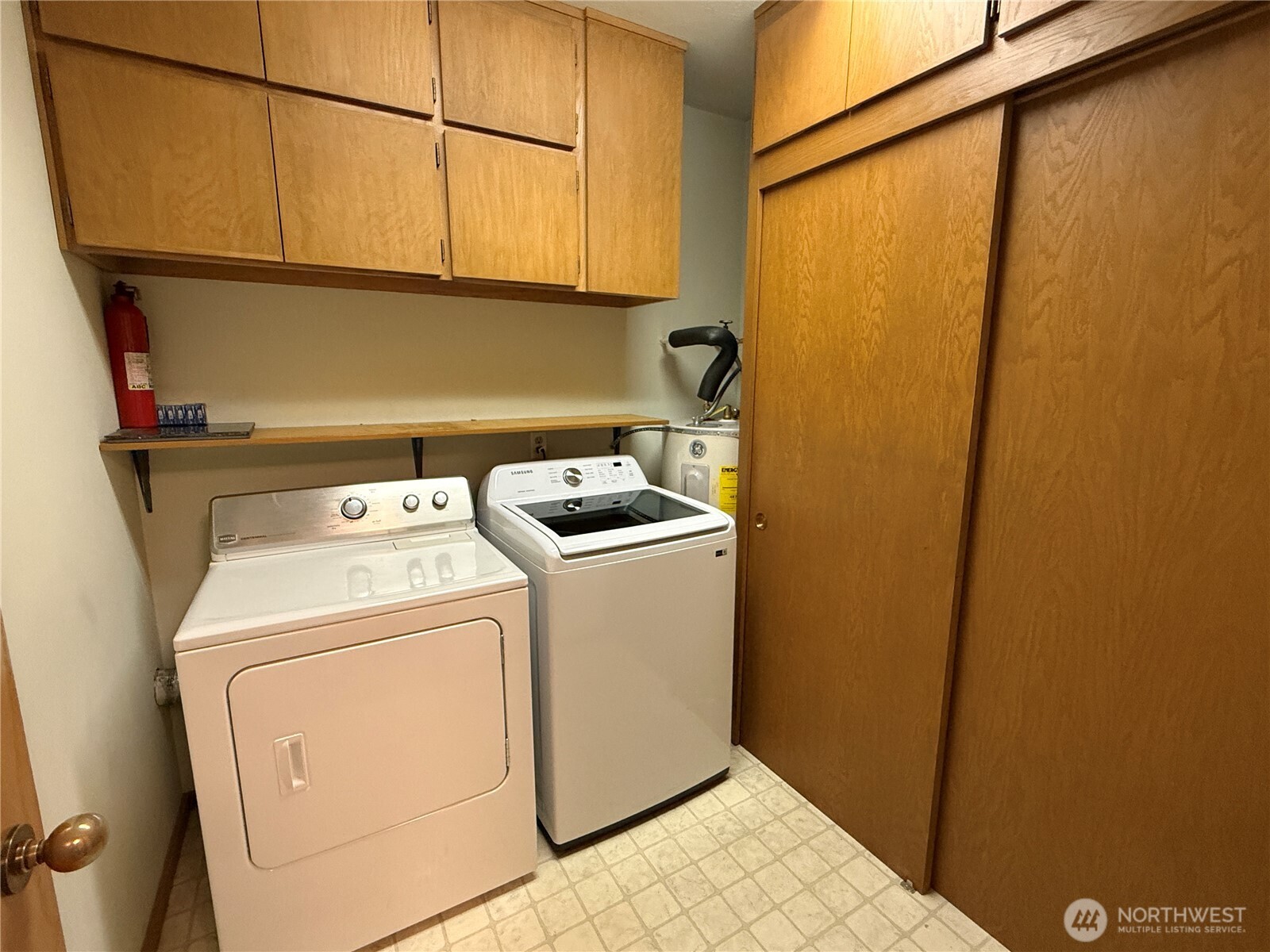 620 West Mercer Place, Unit 2B Seattle, WA 98119 - Photo 23 of 28 a utility room with dryer and washer