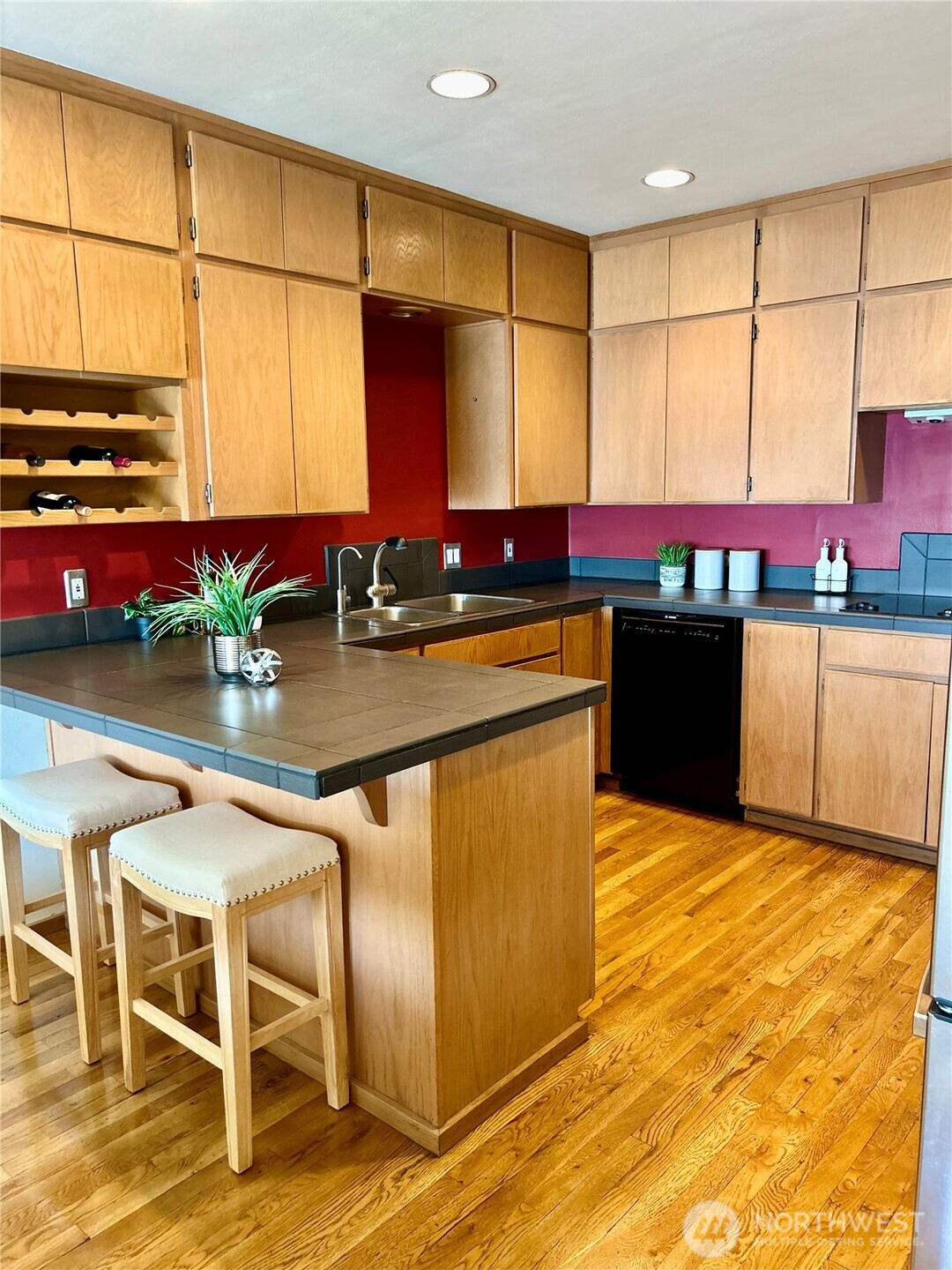 620 West Mercer Place, Unit 2B Seattle, WA 98119 - Photo 9 of 28 a kitchen with stainless steel appliances granite countertop a sink and cabinets