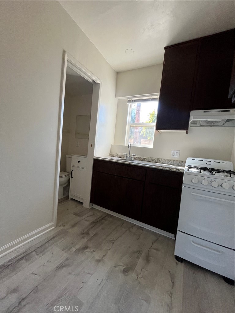 24601 1/2 Richman Drive Loma Linda, CA 92354 - Photo 9 of 13 a room with a sink and cabinets