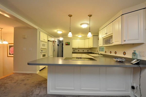 106 South Acton Road Stow, MA 01775 - Photo 3 of 30 a view of a kitchen with a stove