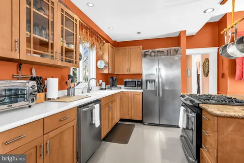 a view of a living room and kitchen