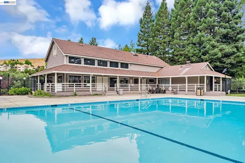 a front view of a house with a swimming pool