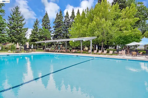 a view of a swimming pool with an outdoor seating