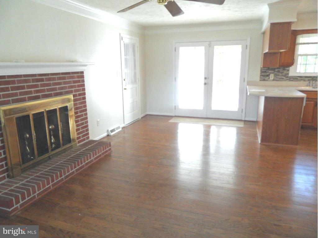 1405 Clearview Road Edgewood, MD 21040 - Photo 8 of 23 a view of an empty room with wooden floor and a window