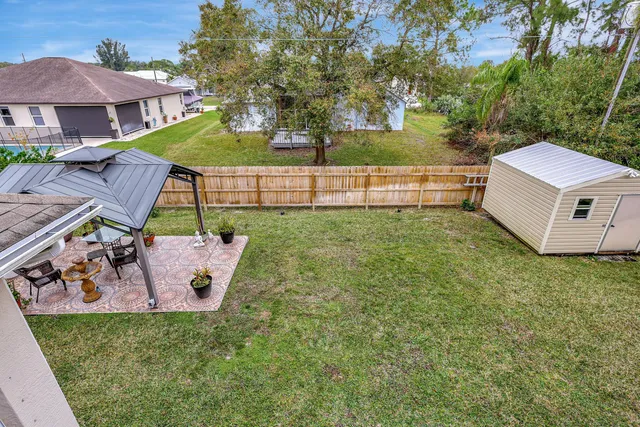 a outdoor living space with furniture and a rug