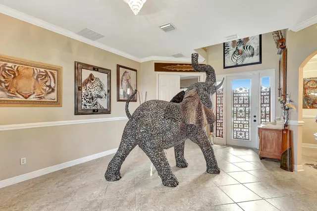 a living room with furniture and large window