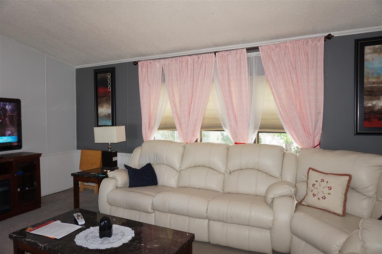 5134 Rockberry Road Loves Park, IL 61111 - Photo 16 of 24 a living room with furniture and a large window