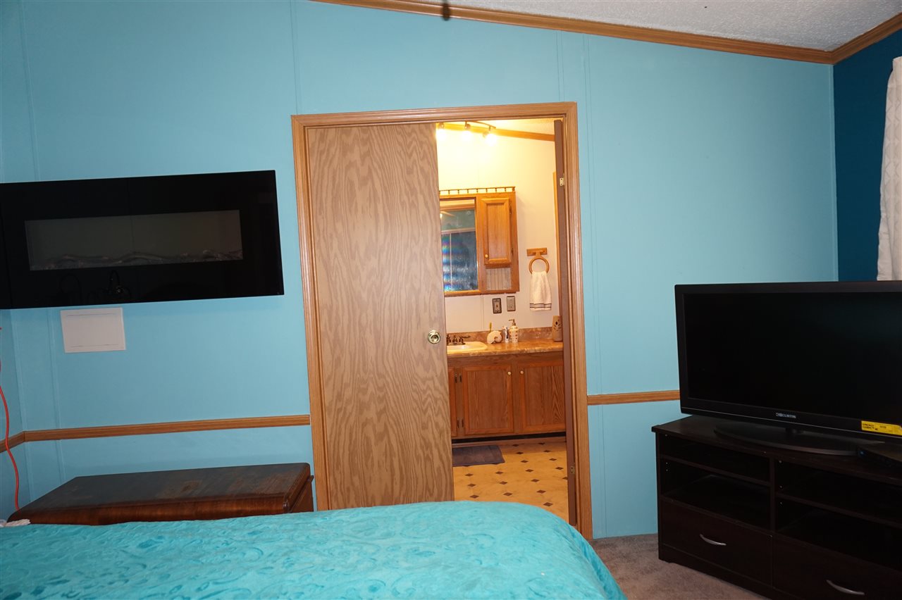 5134 Rockberry Road Loves Park, IL 61111 - Photo 20 of 24 a bedroom with a bed and television