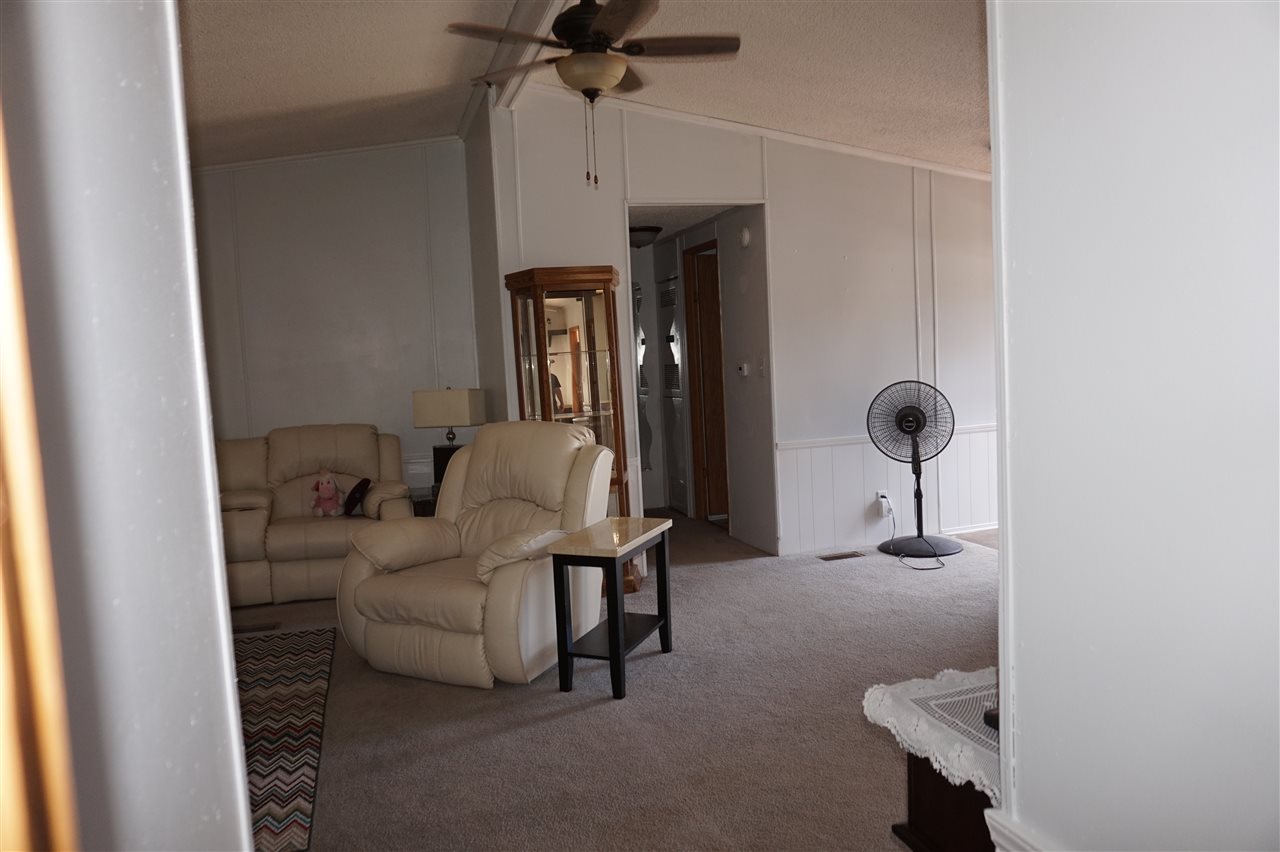 5134 Rockberry Road Loves Park, IL 61111 - Photo 21 of 24 a living room with furniture and a mirror