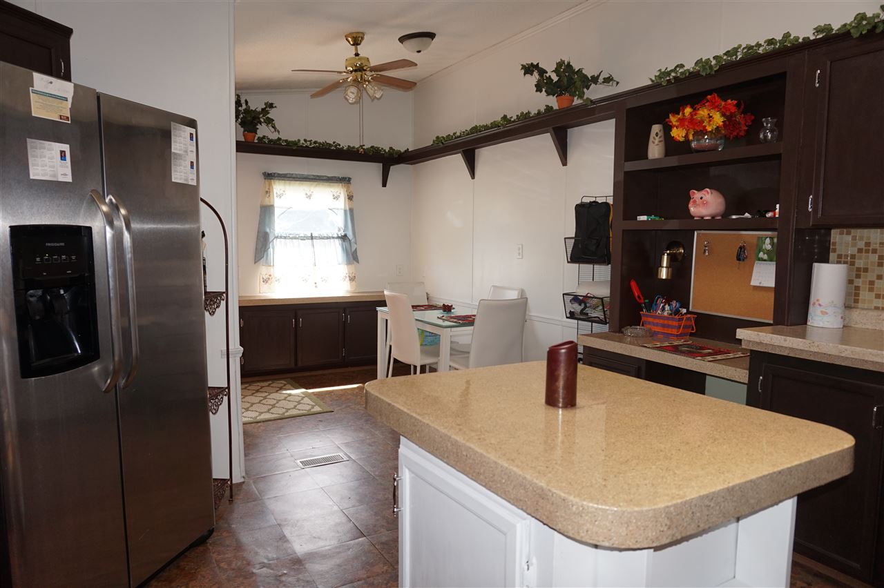 5134 Rockberry Road Loves Park, IL 61111 - Photo 5 of 24 a kitchen with stainless steel appliances a sink and a refrigerator