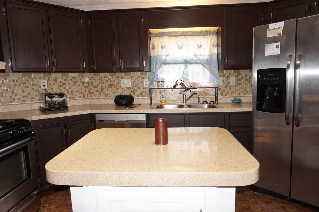 5134 Rockberry Road Loves Park, IL 61111 - Photo 6 of 24 a kitchen with a sink and cabinets
