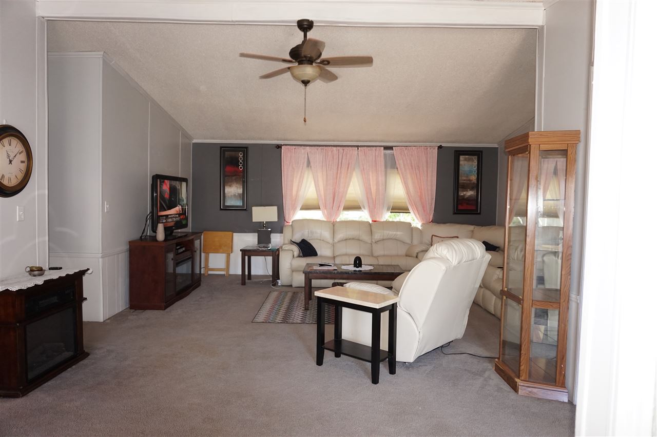 5134 Rockberry Road Loves Park, IL 61111 - Photo 10 of 24 a living room with furniture and a window
