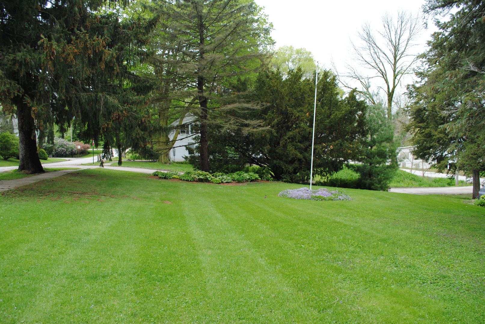 208 Ridge Street Mount Carroll, IL 61053 - Photo 14 of 16 a view of a park with trees and grass