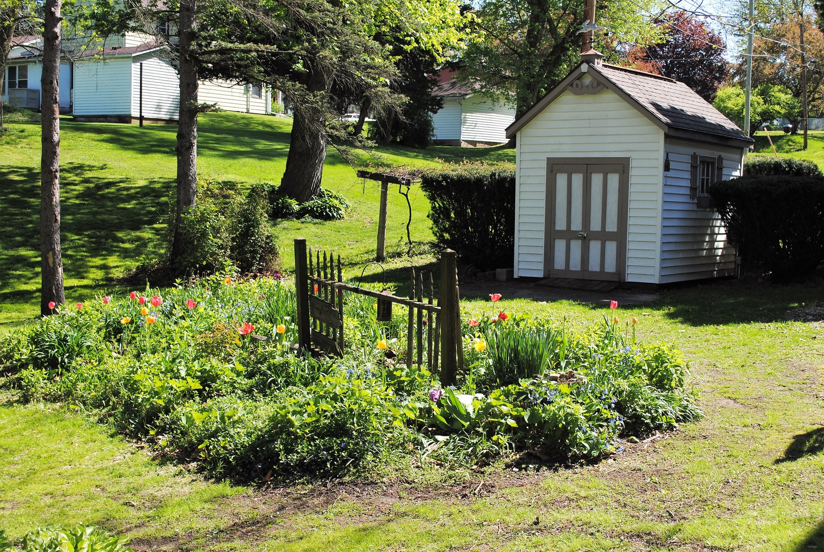 208 Ridge Street Mount Carroll, IL 61053 - Photo 16 of 16 a view of a house with garden and plants