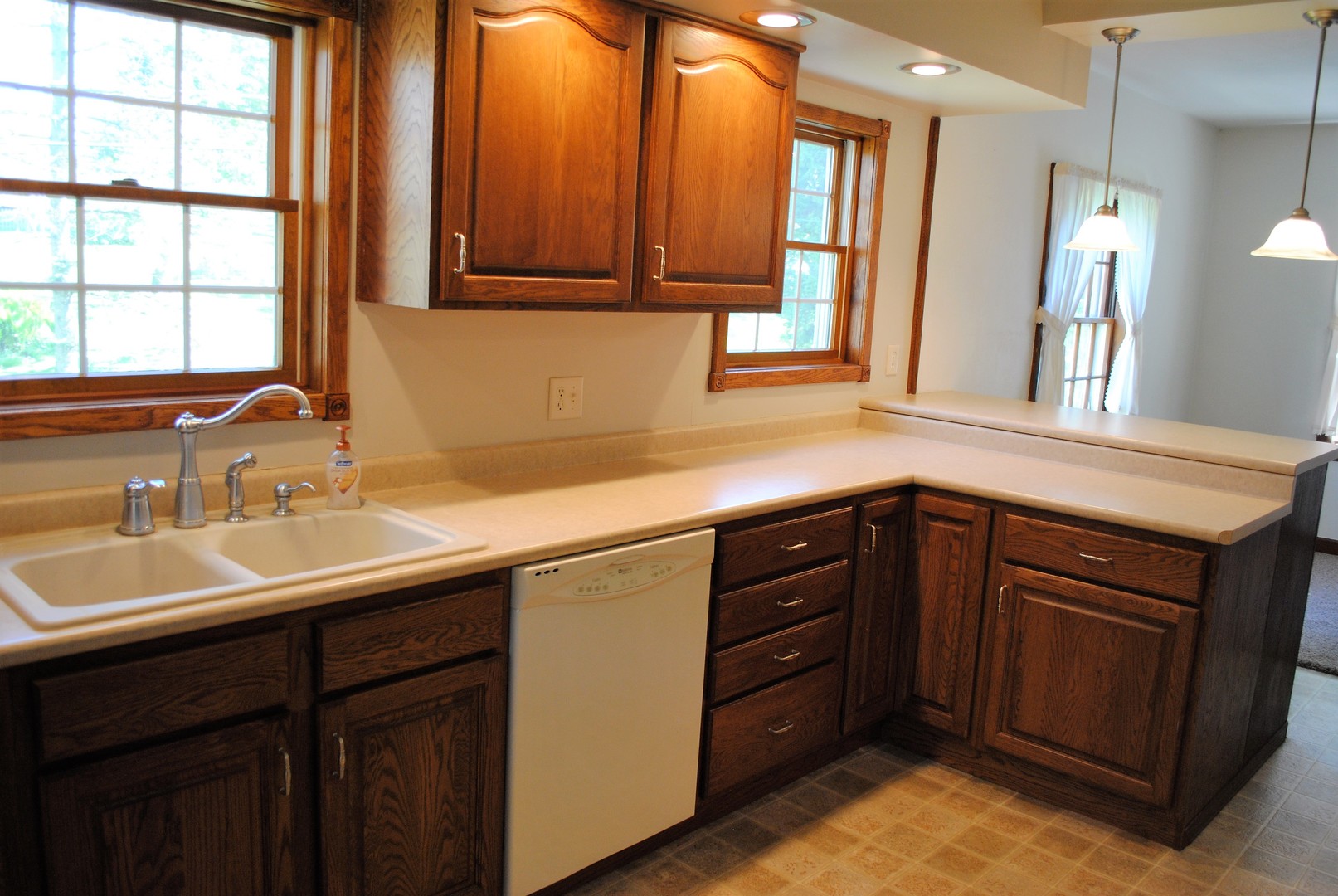 208 Ridge Street Mount Carroll, IL 61053 - Photo 3 of 16 a kitchen with a sink and cabinets