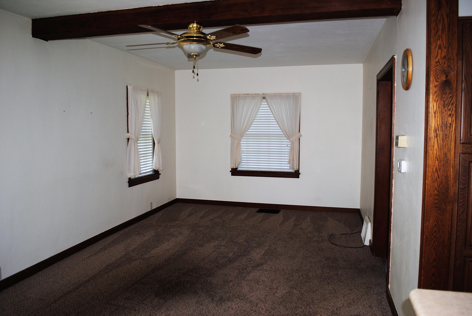 208 Ridge Street Mount Carroll, IL 61053 - Photo 5 of 16 a view of an empty room with a window